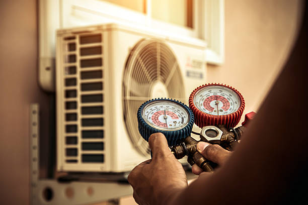 Professional Air Conditioning Service technician working in Clatskanie, OR